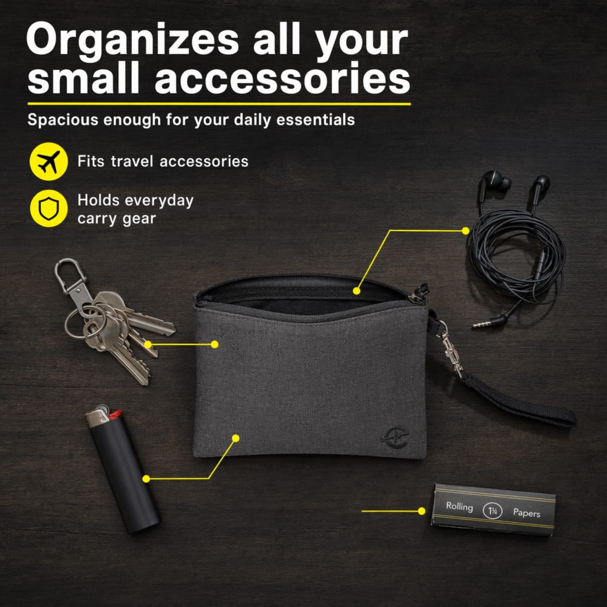 Epulse gray smell proof bag on a wood surface next to keys, a lighter, earbuds, and rolling papers, illustrating everyday-carry storage